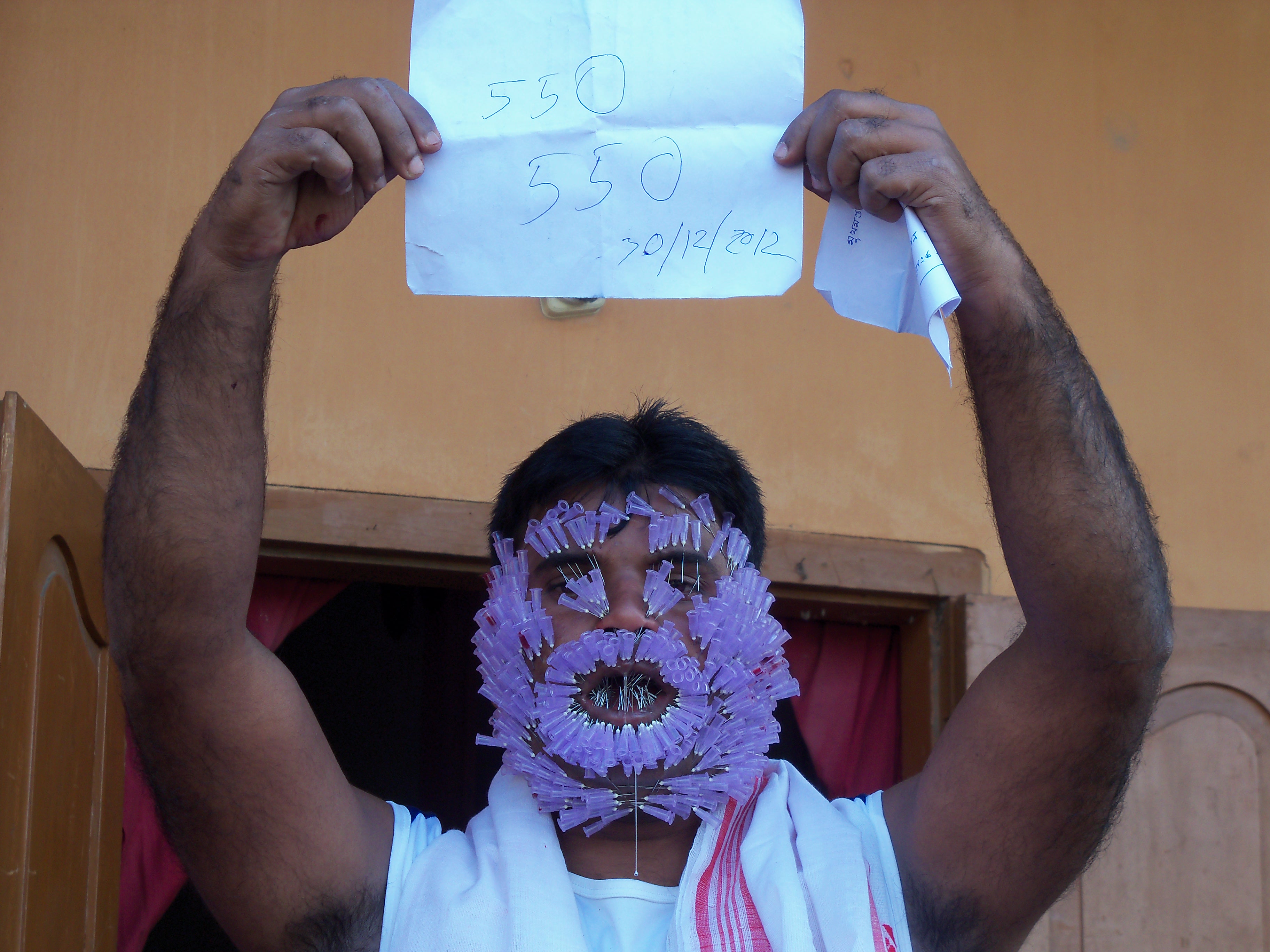 MOST NEEDLES INSERTED INTO FACE India Book of Records