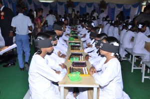 MOST PEOPLE PLAYING CHESS BLINDFOLDED A.P Sivakumar of Satya Sai Academy and K.P Christi Raj-Presidency Hr. Sec. School conducted a chess tournament in which a total of 108 people played blindfolded chess together, on March 2, 2013, at Presidency School, Pondicherry, Tamil Nadu. The event was organized by Satya Sai Chess Academy (Pondicherry). 