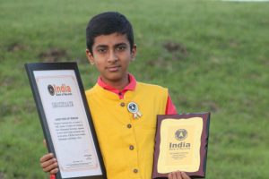 YOUNGEST PERSON TO WRITE MOST ALPHABETS ON A RICE-GRAIN